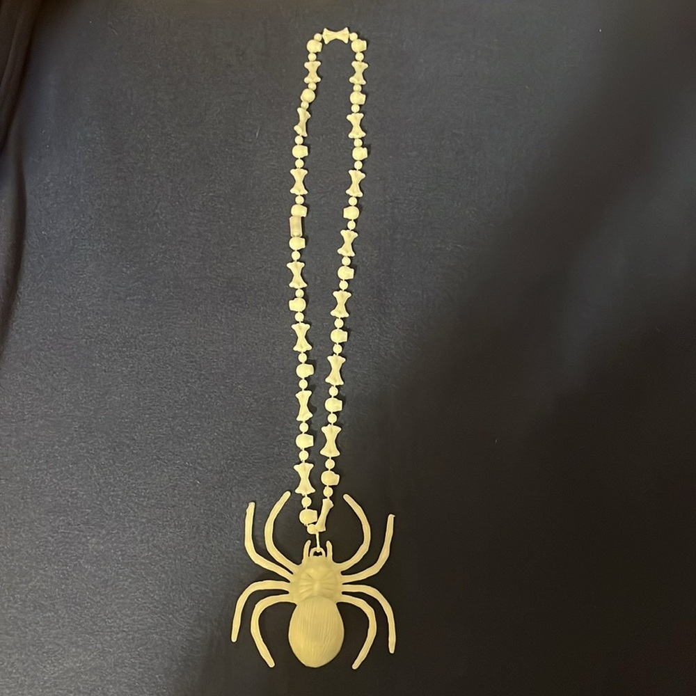 Halloween Spider and bones glow in the dark necklace.